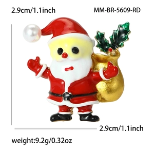 Broche Père Noël émaillée avec sac de cadeaux doré et détail en perle élégante