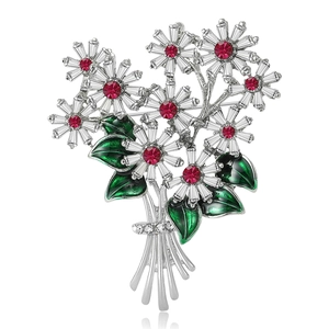 Broche élégante bouquet de marguerites avec cristaux rouges et feuilles en émail vert