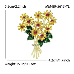 Elegant gold flower bouquet brooch with yellow crystals and green enamel details