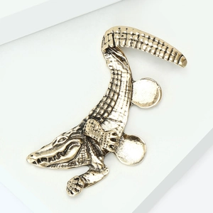Detailed view of the vintage gold alligator ear cuff showing its textured scale pattern