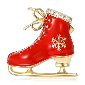 Elegant red enamel ice skate brooch with gold snowflake and sparkling rhinestones