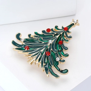Elegant gold Christmas tree brooch with green enamel and sparkling rhinestones