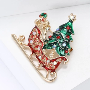 Christmas sleigh with tree brooch in gold alloy finish and colorful rhinestones