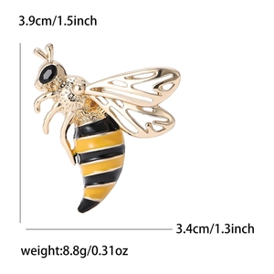 Cute bee brooch in gold metal with black and yellow enamel, wings detail and dimensions