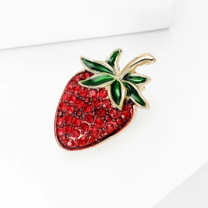 Exquisite strawberry brooch with red crystals and green enamel on a golden metal base
