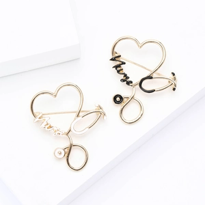 Creative stethoscope heart enamel brooch with Nurse lettering in black and white finish