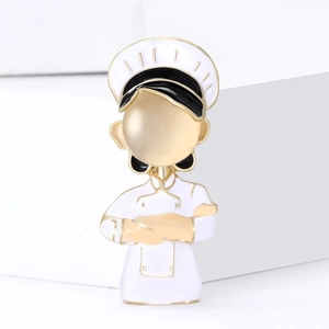 Creative chef brooch with gold-plated metal, white enamel, and beige cat eye stone inlay