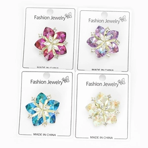 Detailed set of four crystal sunflower brooches in rose, purple, blue and iridescent colors