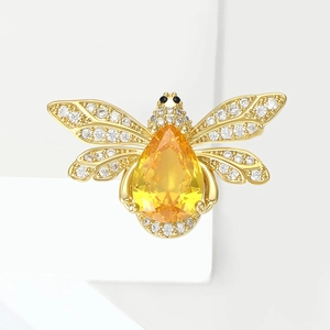 Exquise broche abeille vintage avec grosse pierre jaune en poire et ailes en cristaux