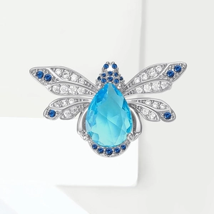 Broche abeille vintage argentée avec pierre goutte bleue et strass brillants