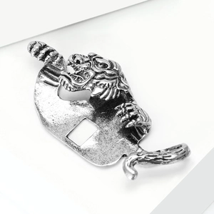 Macro shot of tiger head lapel pin showing antique silver alloy texture and details