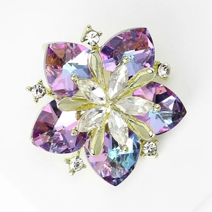 Detail of luxury crystal sunflower brooch with purple and blue petals in gold setting