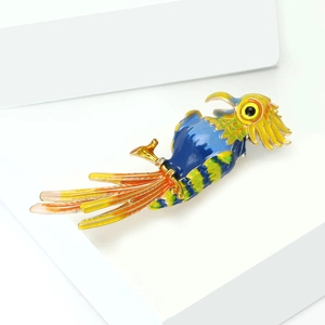 Detailed macro view of colorful enamel parrot brooch with vibrant blue and yellow feathers
