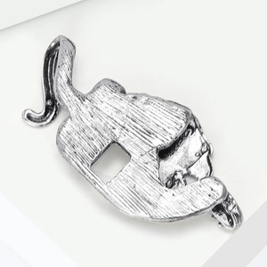 Detail of vintage tiger brooch back with vertical textures and hollowed silver metal