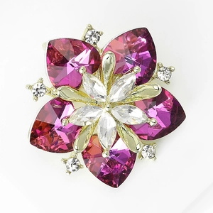 Detailed macro view of crystal sunflower brooch with pink heart-shaped petals in silver setting