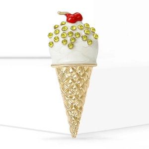 Minimalist ice cream brooch with red cherry, white enamel, and yellow rhinestones