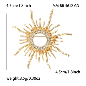 Golden sunburst brooch with white rhinestones, size 4.5cm and weight 8.5g