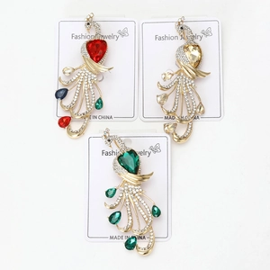 Detailed close-up of luxury peacock brooches with sparkling crystals and alloy finish