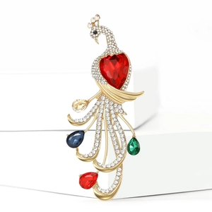Detailed close-up of a luxury peacock brooch with colorful rhinestones on white steps
