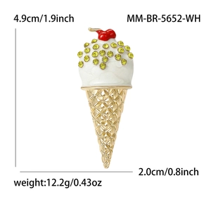 Golden ice cream cone brooch with white cream, yellow rhinestones and a red cherry