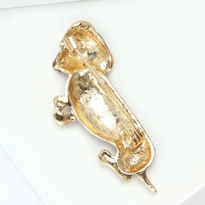 Detailed back view of gold poodle brooch showing the sturdy metal pin fastener