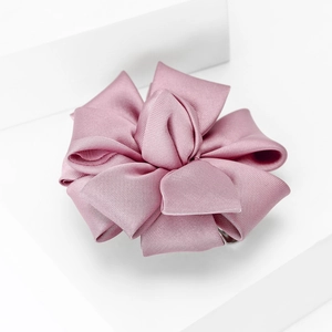 Detail of multi-layered dusty pink satin flower brooch with elegant fabric texture