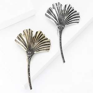 Elegant ginkgo leaf brooch in gold and silver finish with black sparkling rhinestones