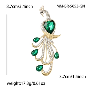 Luxurious gold peacock brooch with green heart gemstone and sparkling crystals for women