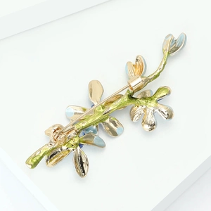 Detailed view of the gold-plated alloy brooch back showing the pin closure and craftsmanship