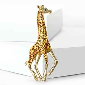 Charming enamel giraffe brooch with brown spots and green gemstone eye on gold base