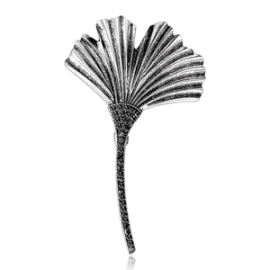 Silver ginkgo leaf brooch with black rhinestones for coats and suits on white background