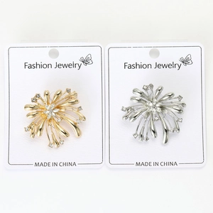 Détails des broches feu d'artifice en or et argent avec des strass blancs étincelants