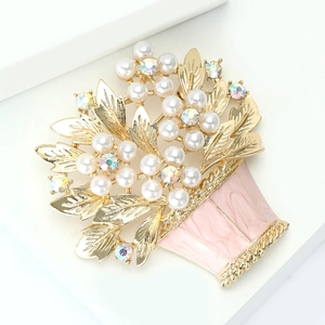 Detailed close-up of alloy flower basket brooch with pink enamel and sparkling rhinestones