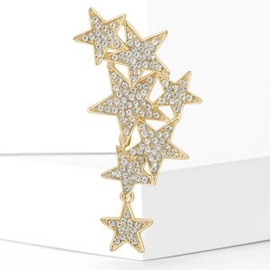 Close-up of sparkling rhinestone stars brooch in gold finish with dangling star pendant