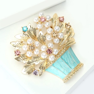 Detail of flower basket brooch with blue enamel and colorful crystals for suits