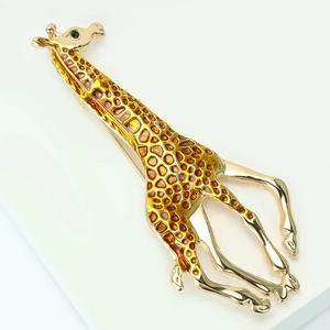 Charming enamel giraffe brooch in golden alloy with yellow spots and green eye accent