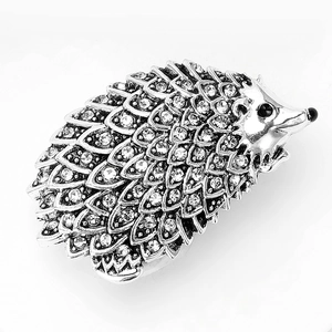 Detailed view of hedgehog brooch with silver plating and sparkling rhinestones