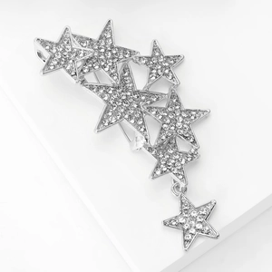 Detail view of silver star brooch with pavé rhinestones and a dangling star charm