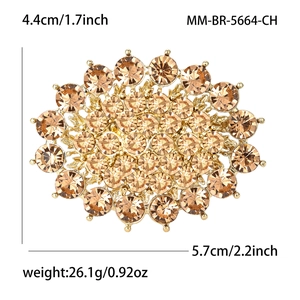 Luxury oval champagne rhinestone brooch with gold metal base and size 5.7cm x 4.4cm details