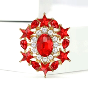 Elegant gold alloy brooch with red oval stone and sparkling rhinestone star design