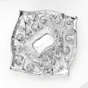 Detailed back view of silver alloy brooch with pin closure and secure safety rotary clasp