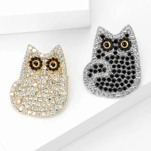 Elegant cat brooch set with gold and silver finishes featuring sparkling rhinestones