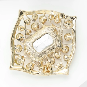 Detailed back view of a vintage alloy brooch showing the secure metal pin fastener
