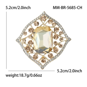 Vintage alloy rhombus brooch with amber glass gemstone and gold hollow design