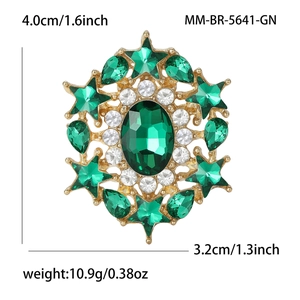Star-shaped green crystal brooch in gold alloy with precise dimensions and weight info