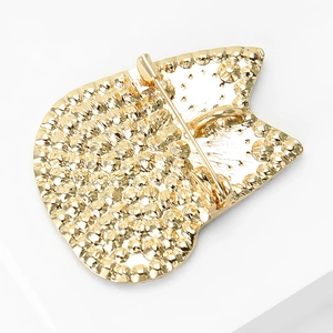 Detailed back view of a gold cat brooch showing the pin clasp and textured finish