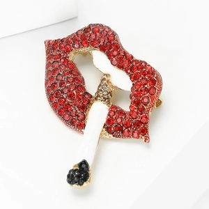 Detailed view of creative red rhinestone lips and white enamel cigarette brooch pin
