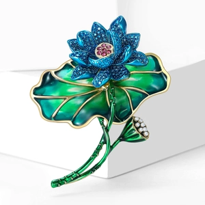 Elegant lotus flower brooch with blue crystals and green enamel lotus leaf design