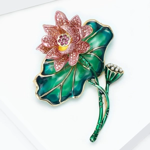 Detail of pink lotus brooch with enamel green leaf and pearl lotus seed accents