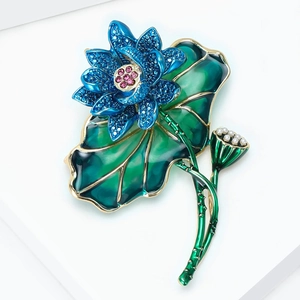 Detailed blue enamel lotus brooch with green lily pad leaf and small pearl accents